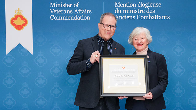 Minister of Veterans Affairs Darren Fisher (left) and Jane Hall (right).