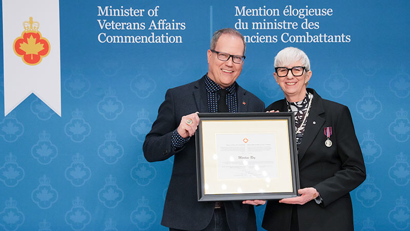 Minister of Veterans Affairs Darren Fisher (left) and Martine Roy (right).