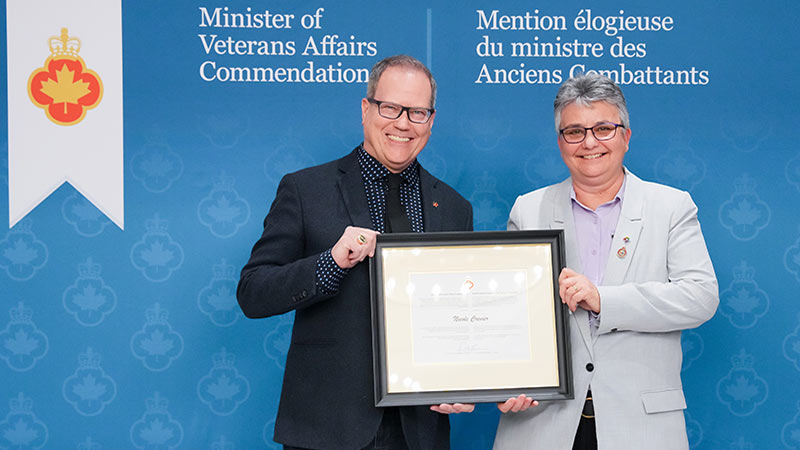 Minister of Veterans Affairs Darren Fisher (left) and Nicole Crevier (right).