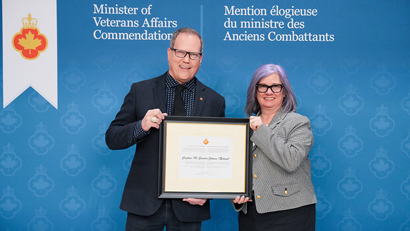 Minister of Veterans Affairs Darren Fisher (left) and Sandra Jalonen (right).
