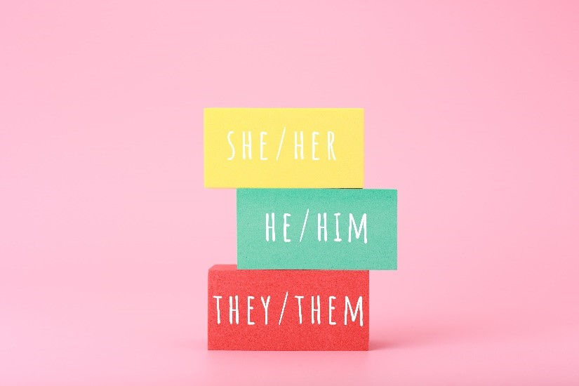 Stacked blocks printed with pronouns