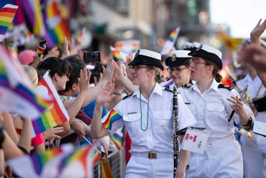 An image of military members in a pride parade