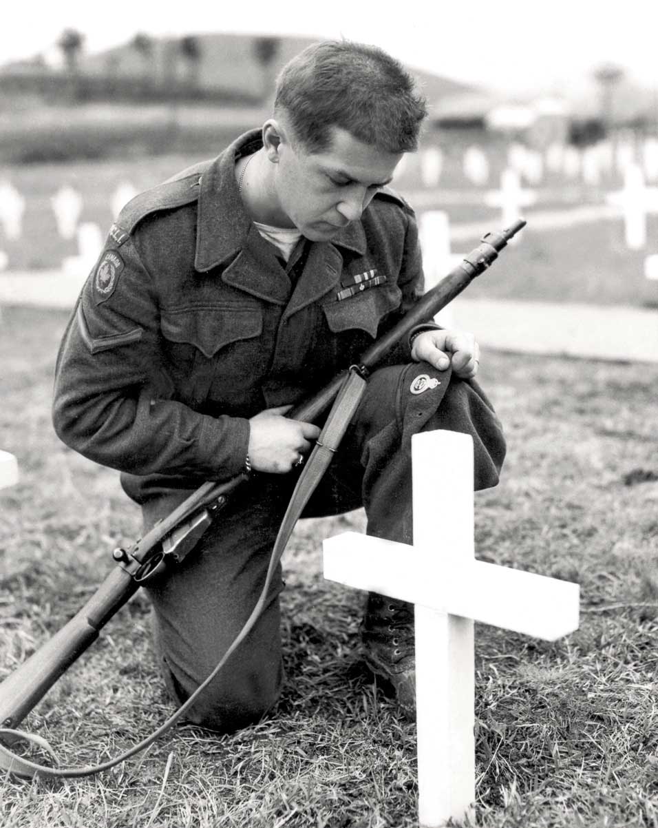 At the Grave of a Comrade | Photo: LAC PA-128813